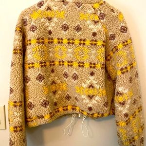 Soft and fuzzy shearling-like jacket that zips up . Fun to mix and match!